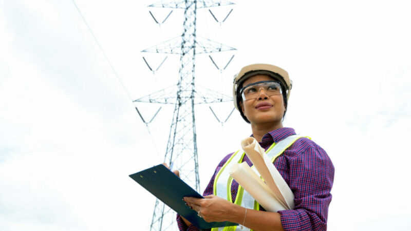 Electrical,Engineer,Checking,Location,Site,Near,To,High,Voltage,Tower.