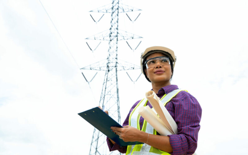 Electrical,Engineer,Checking,Location,Site,Near,To,High,Voltage,Tower.