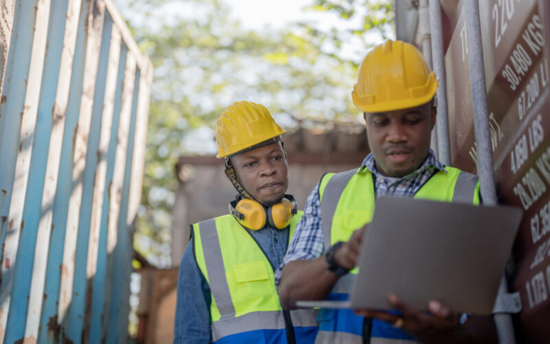 African workers, Engineer, Technician holding laptop for checkin